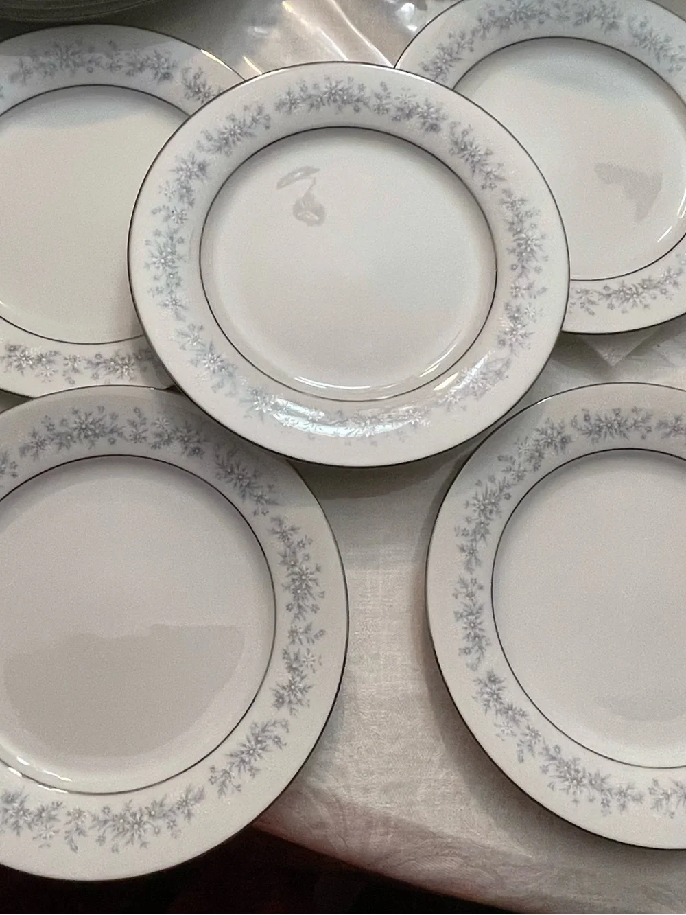 Noritake White Dinner Plate with Pale Blue Floral and Silver Trim